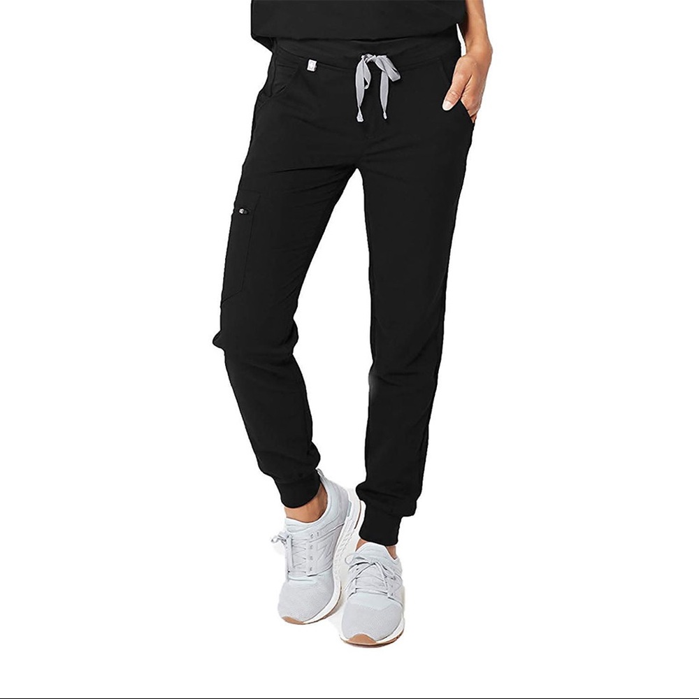 Figs, black jogger pants.